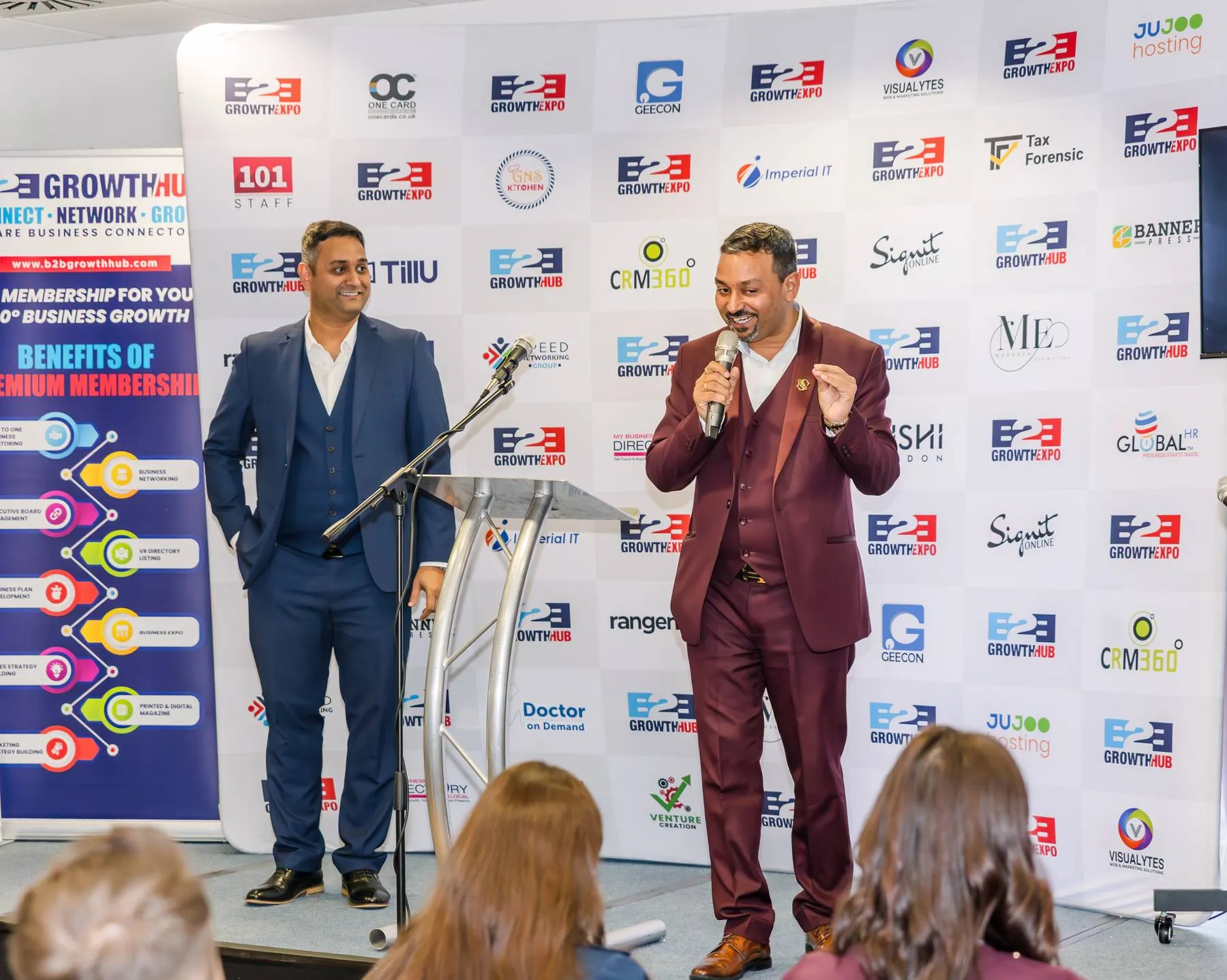 Business owners networking at a B2B Growth Expo show